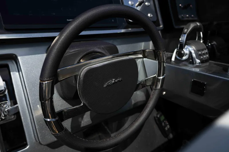  Yacht Photos Pics Steering wheel of 2022 Riva Dolceriva luxury boat, showcasing sleek design and controls.
