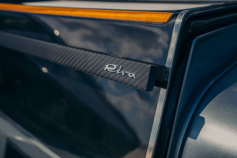  Yacht Photos Pics 2022 Riva Dolceriva boat detail with logo and sleek design.
