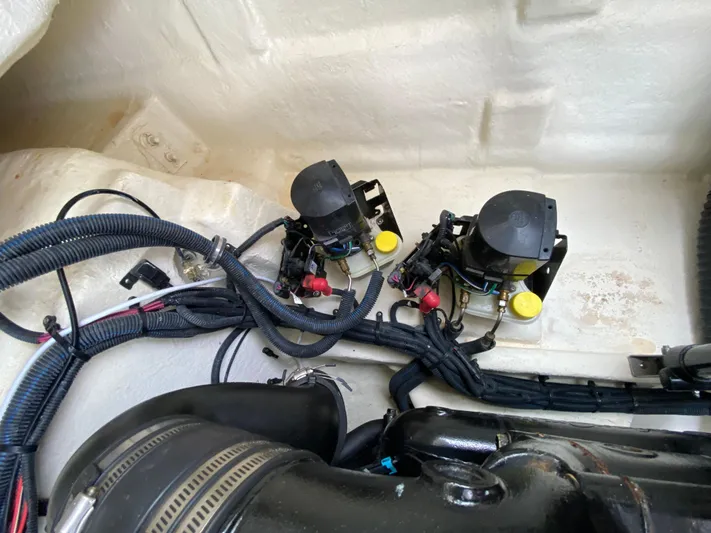 Casa - 2022 Sr 310 Slx @ Cancun Yacht Photos Pics Engine compartment of 2022 Sea Ray SLX 310 with wiring and components visible.