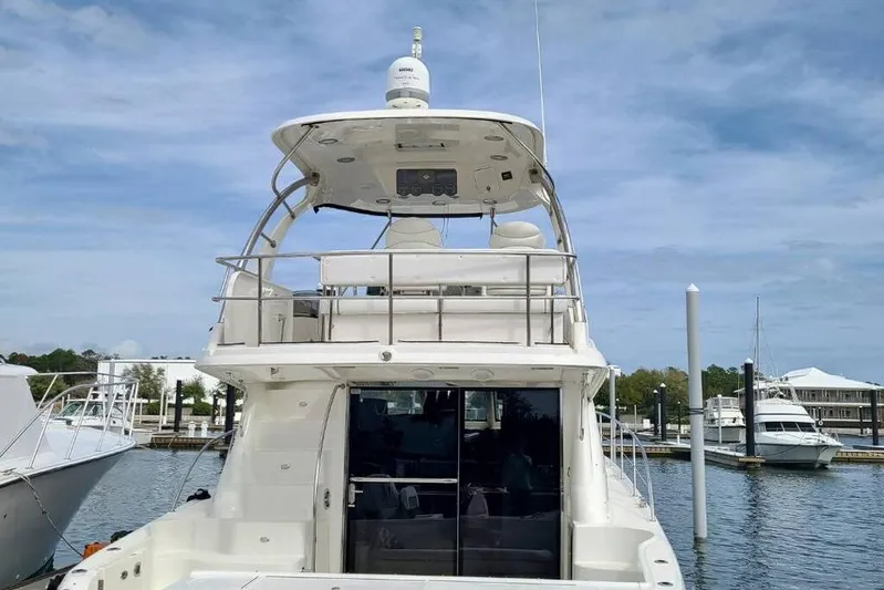 Verdee Yacht Photos Pics 2007 Sea Ray 52 Sedan Bridge yacht docked at marina under clear sky.
