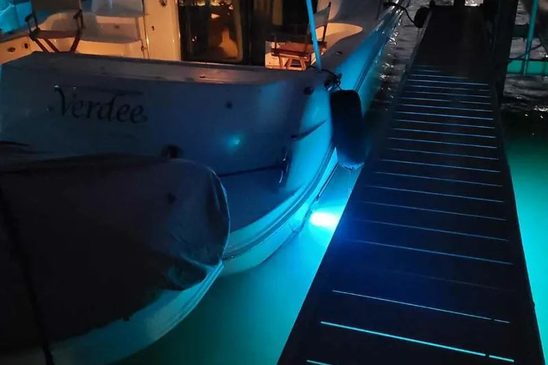 Verdee Yacht Photos Pics 2007 Sea Ray 52 Sedan Bridge docked at night with blue underwater lights.