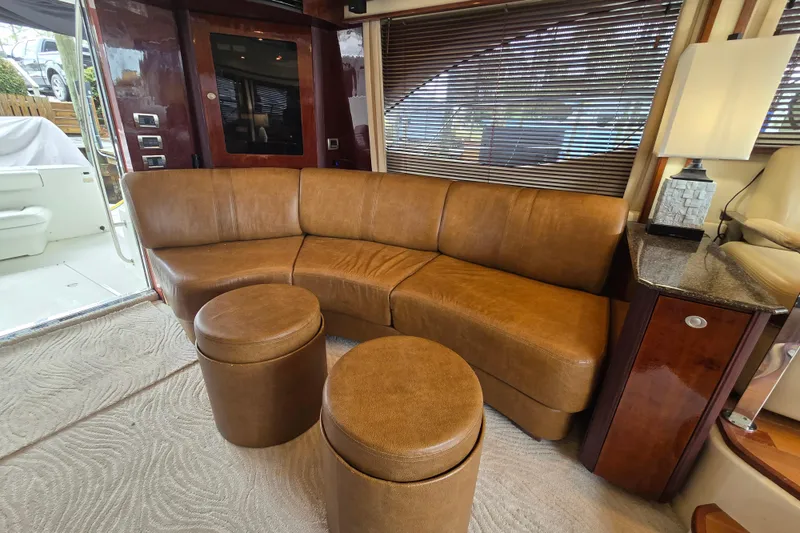 Verdee Yacht Photos Pics Luxurious interior of 2007 Sea Ray 52 Sedan Bridge with leather seating and elegant decor.
