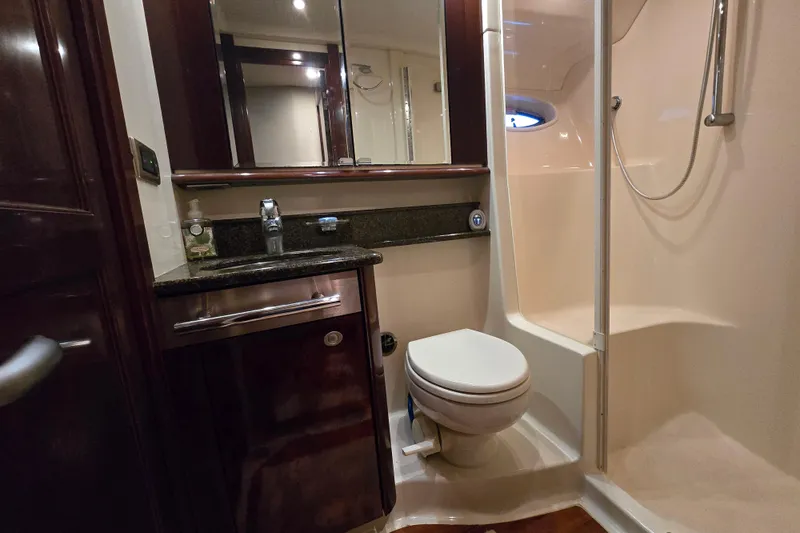 Verdee Yacht Photos Pics Luxurious bathroom in 2007 Sea Ray 52 Sedan Bridge yacht with shower and vanity.