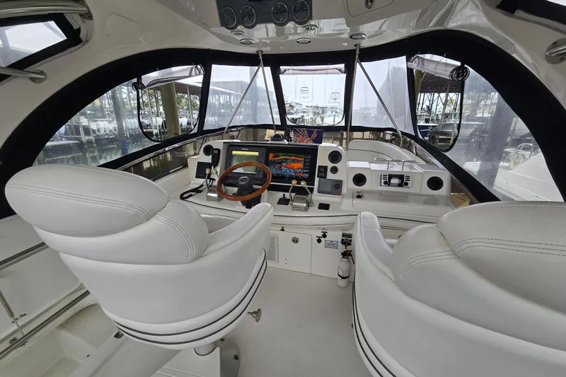 Verdee Yacht Photos Pics Interior cockpit of 2007 Sea Ray 52 Sedan Bridge with modern navigation equipment.