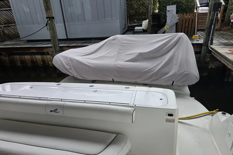 Verdee Yacht Photos Pics 2007 Sea Ray 52 Sedan Bridge yacht with covered equipment on deck, docked in marina.