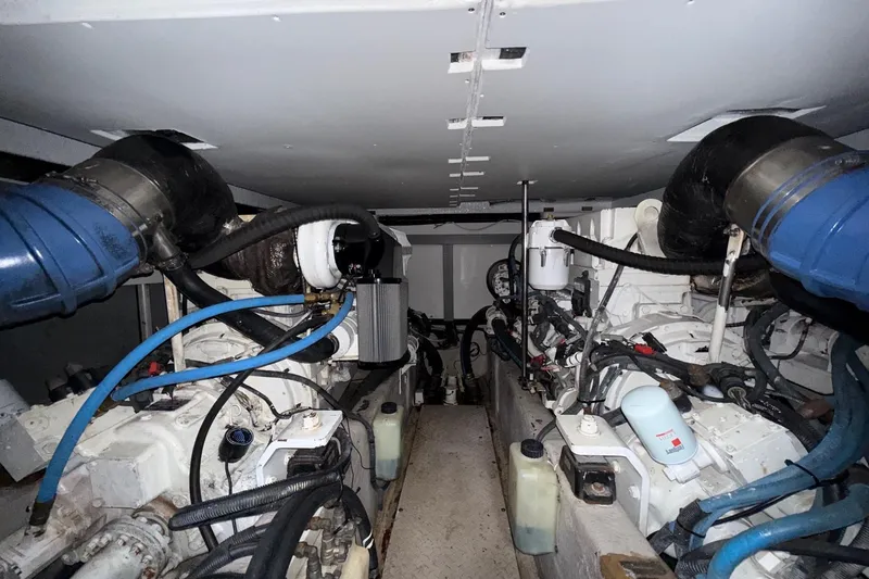 Verdee Yacht Photos Pics Engine room of a 2007 Sea Ray 52 Sedan Bridge yacht, showcasing dual engines and components.
