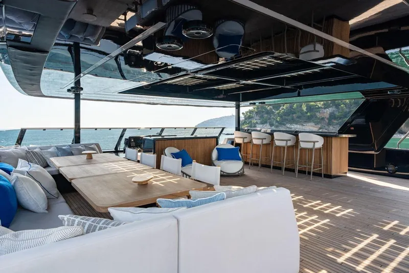 Petite Belle Yacht Photos Pics Luxurious Sunreef 100 Power yacht interior, featuring elegant seating and ocean views, 2025 model.