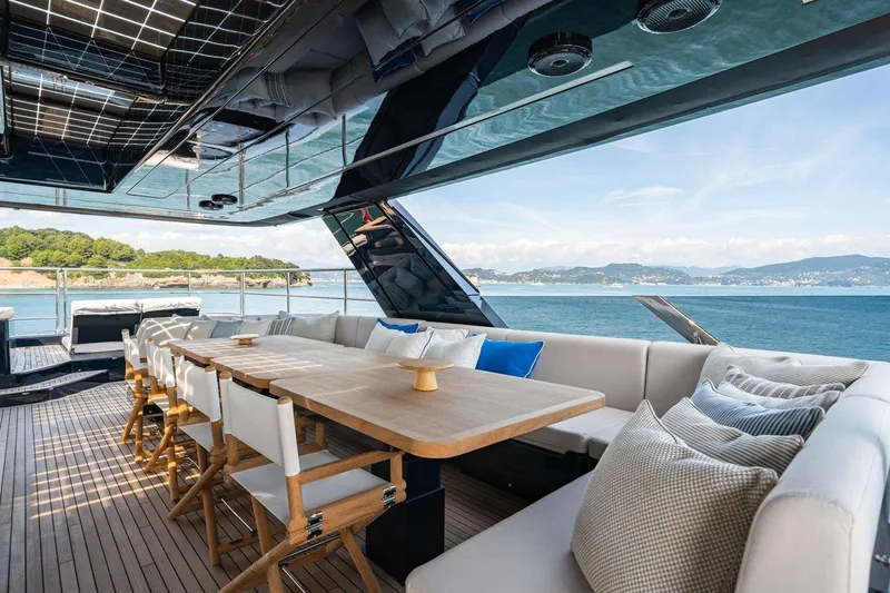 Petite Belle Yacht Photos Pics Luxurious Sunreef 100 Power yacht deck with elegant seating, ocean view, and modern design, 2025 model.