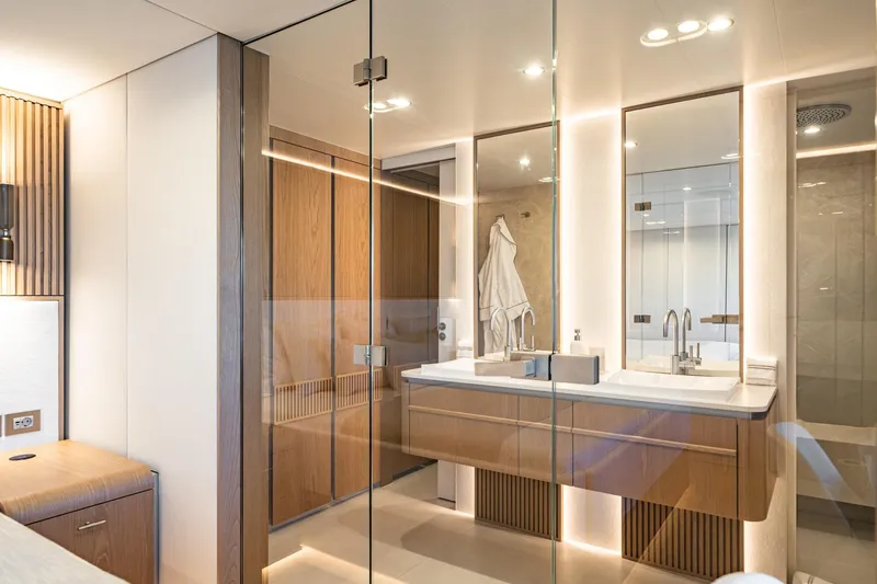 Petite Belle Yacht Photos Pics Luxurious bathroom interior on 2025 Sunreef 100 Power yacht, featuring modern fixtures and elegant wood accents.