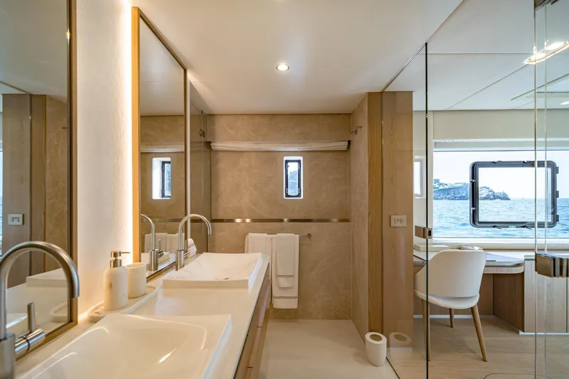 Petite Belle Yacht Photos Pics Luxurious bathroom interior of 2025 Sunreef 100 Power yacht with ocean view.