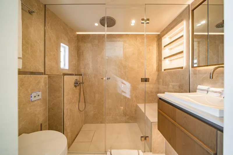 Petite Belle Yacht Photos Pics Luxurious bathroom in 2025 Sunreef 100 Power yacht with modern fixtures and elegant design.