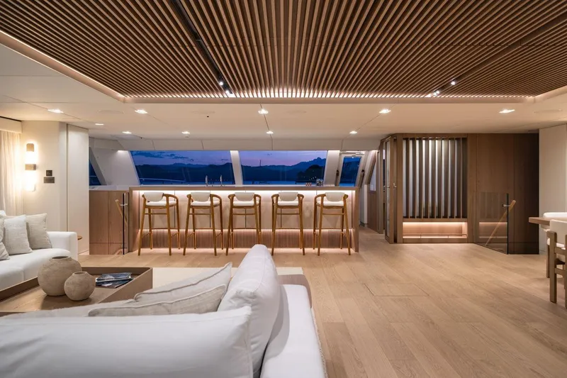 Petite Belle Yacht Photos Pics Luxurious interior of 2025 Sunreef 100 Power yacht with modern design and elegant furnishings.