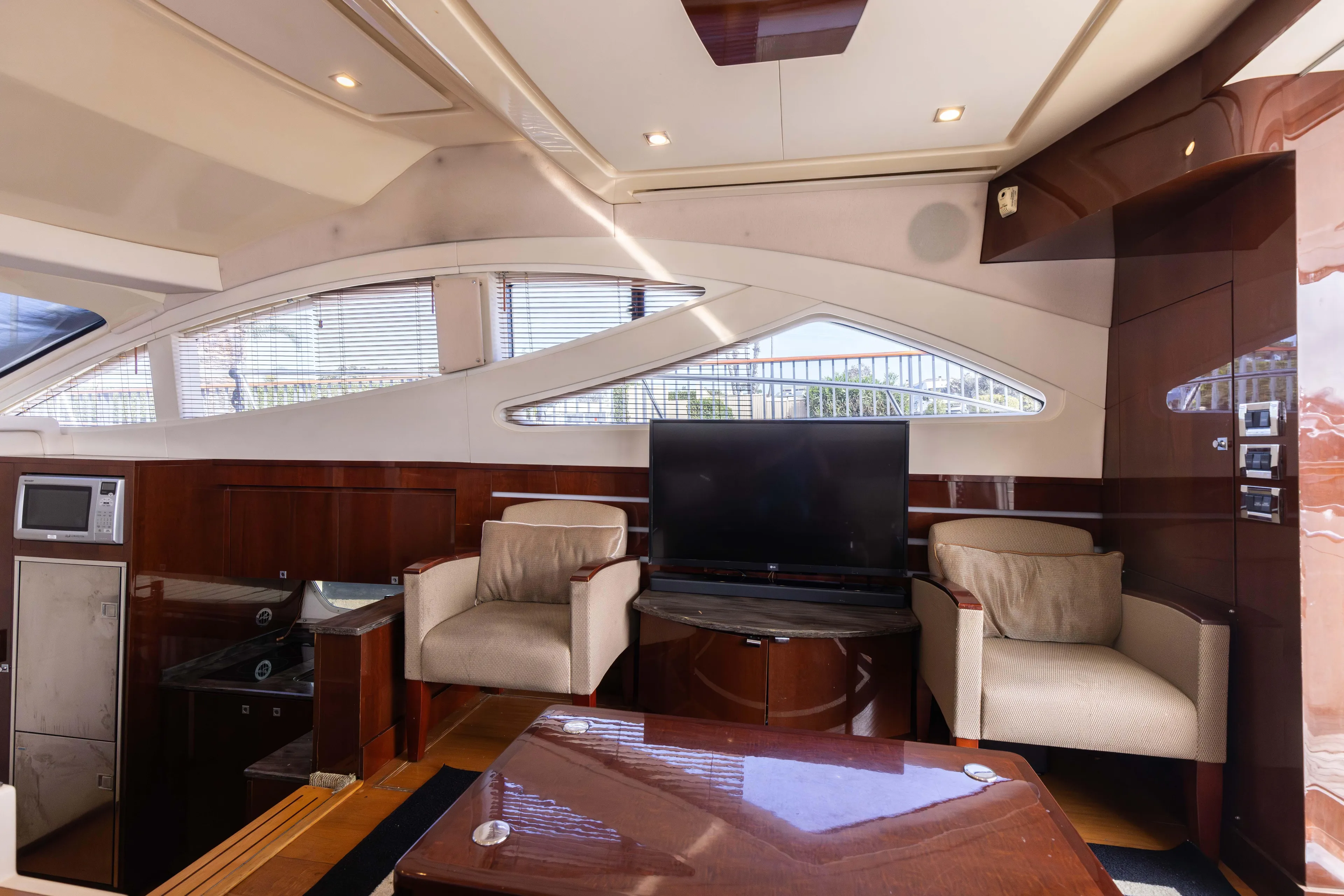 Ka-bar Yacht Photos Pics Luxurious interior of 2012 Sea Ray 450 Sedan yacht with modern furnishings.