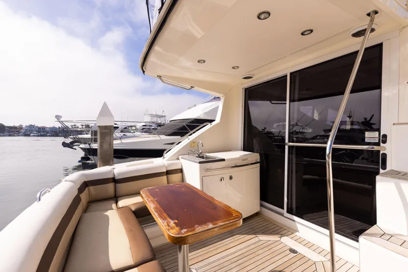 Ka-bar Yacht Photos Pics 2012 Sea Ray 450 Sedan yacht deck with seating and marina view.