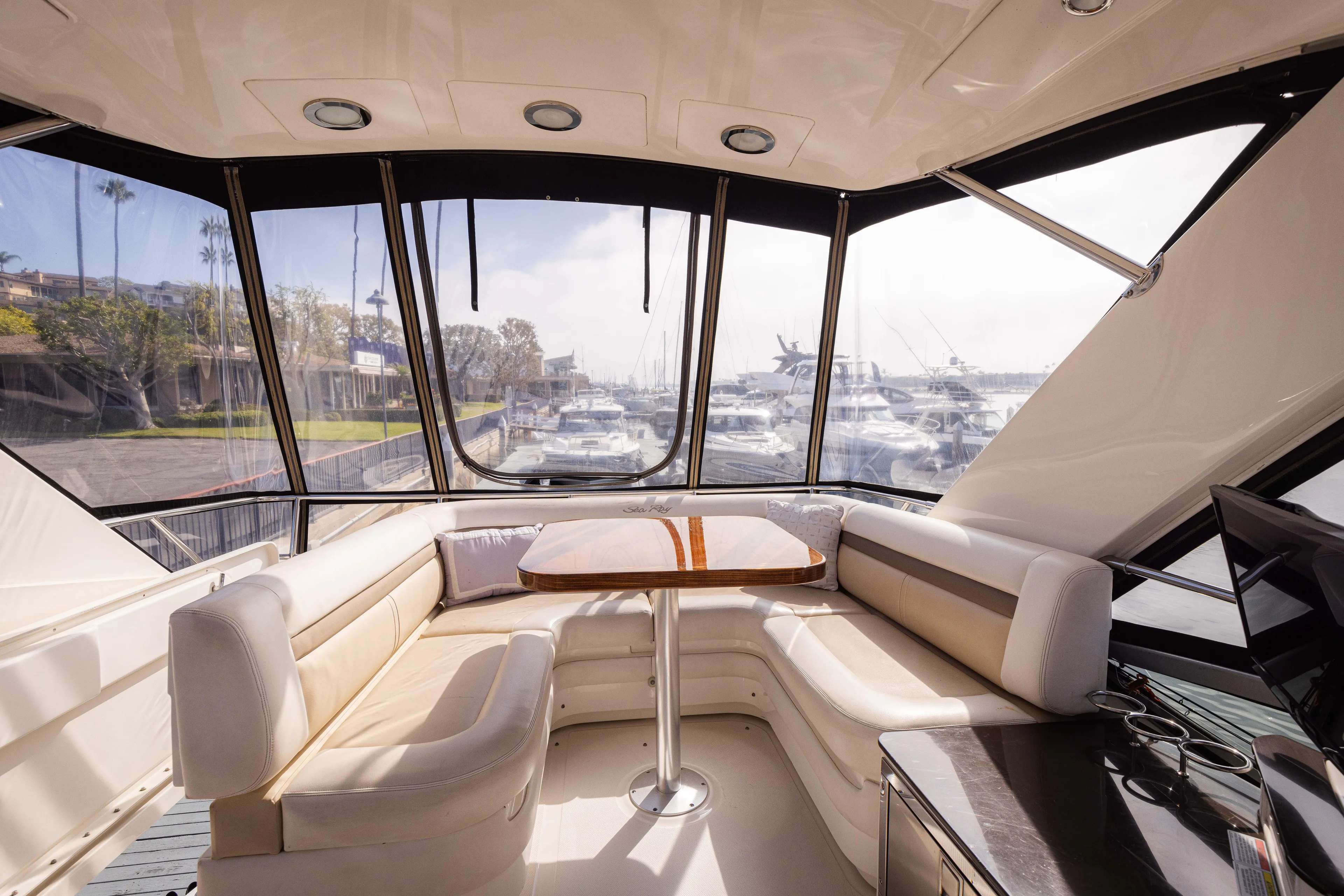 Ka-bar Yacht Photos Pics Luxurious interior of 2012 Sea Ray 450 Sedan yacht with panoramic windows and plush seating.