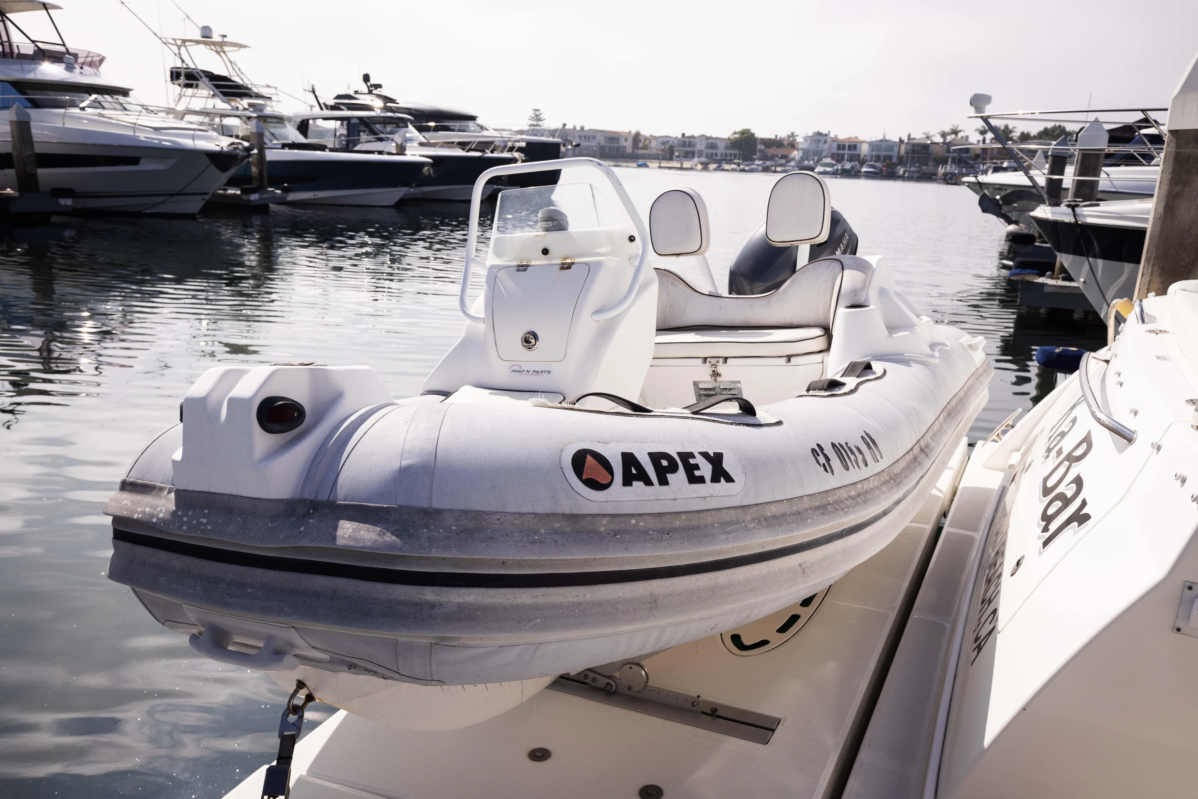 Ka-bar Yacht Photos Pics Apex inflatable boat docked near 2012 Sea Ray 450 Sedan yacht.