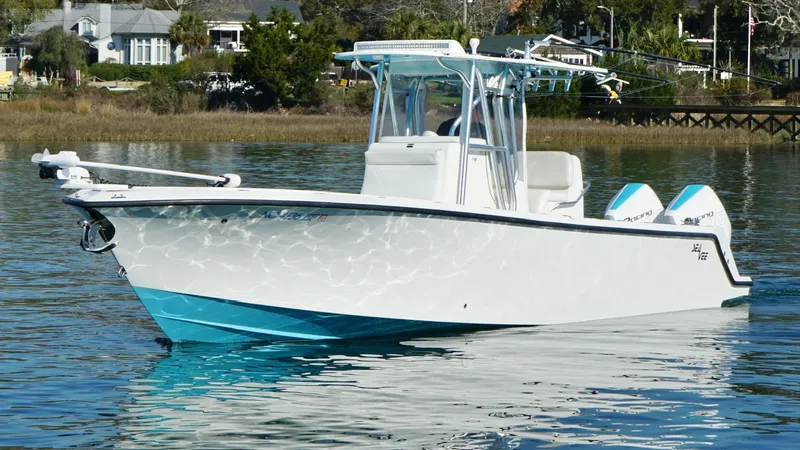  Yacht Photos Pics 2017 SeaVee 320B boat on calm water, featuring a sleek white and blue design.