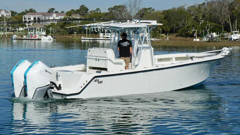  Yacht Photos Pics 2017 SeaVee 320B boat on calm water with dual outboard engines.