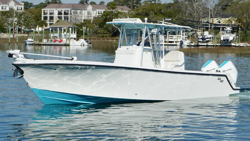  Yacht Photos Pics 2017 SeaVee 320B boat on calm water, featuring a sleek white and turquoise design.