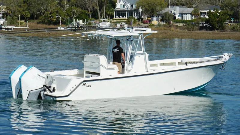  Yacht Photos Pics 2017 SeaVee 320B boat on calm water, featuring dual outboard engines.