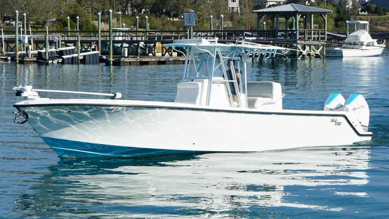  Yacht Photos Pics 2017 SeaVee 320B boat on calm water near a marina.