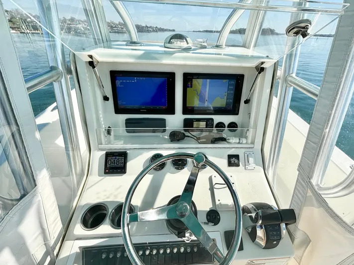  Yacht Photos Pics 2017 SeaVee 320B boat helm with dual navigation screens and steering wheel.