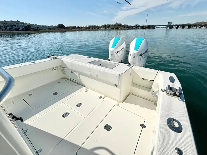  Yacht Photos Pics 2017 SeaVee 320B boat with twin outboard engines on calm water.