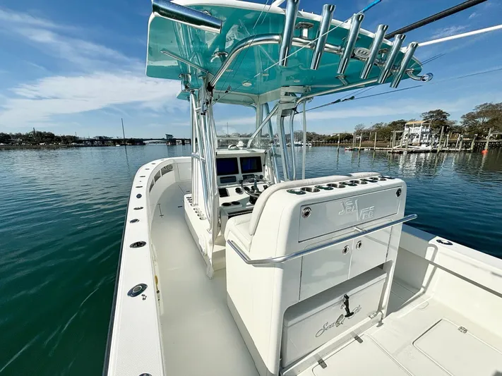  Yacht Photos Pics 2017 SeaVee 320B boat with center console on calm water.