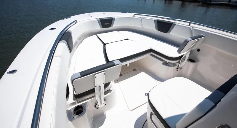  Yacht Photos Pics 2023 Robalo R270 Center Console boat interior with seating and cup holders.