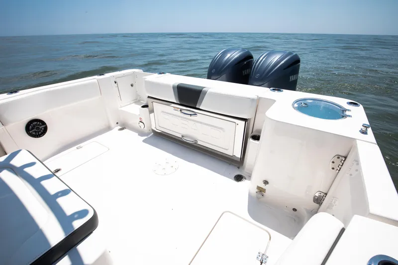  Yacht Photos Pics 2023 Robalo R270 Center Console boat with dual Yamaha engines on open water.