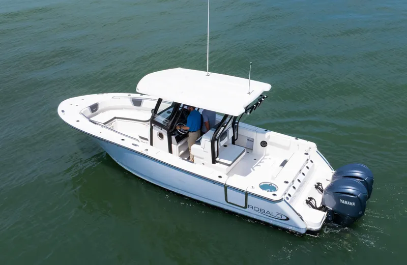  Yacht Photos Pics 2023 Robalo R270 Center Console boat on water, featuring dual Yamaha engines.