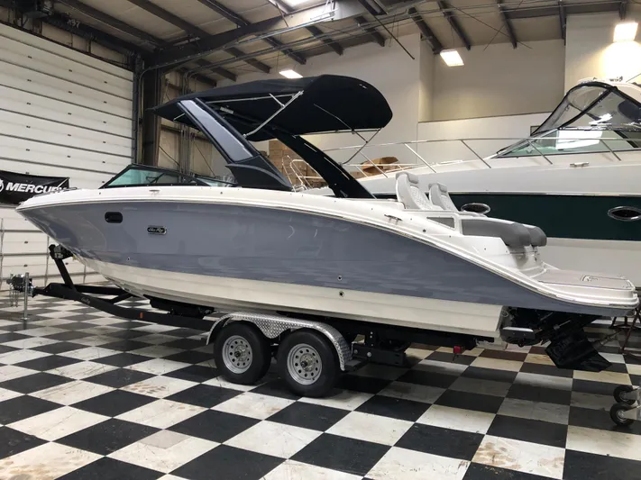  Yacht Photos Pics 2025 Sea Ray SDX 290 boat on trailer in indoor showroom.