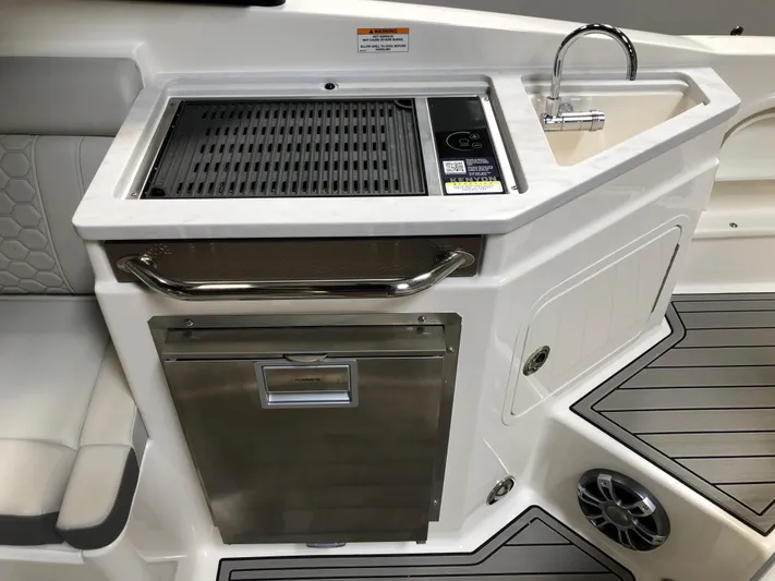  Yacht Photos Pics 2025 Sea Ray SDX 290 boat kitchen area with grill, sink, and storage.