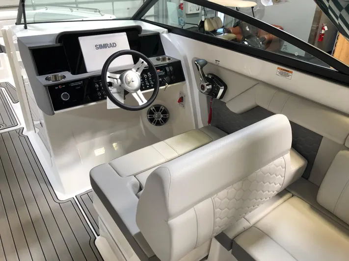  Yacht Photos Pics 2025 Sea Ray SDX 290 boat interior with modern steering and seating.