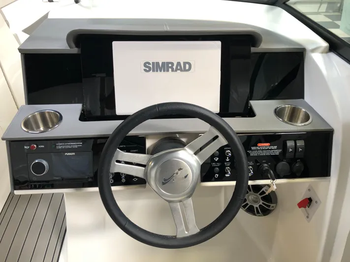  Yacht Photos Pics 2025 Sea Ray SDX 290 helm with Simrad display and steering wheel.