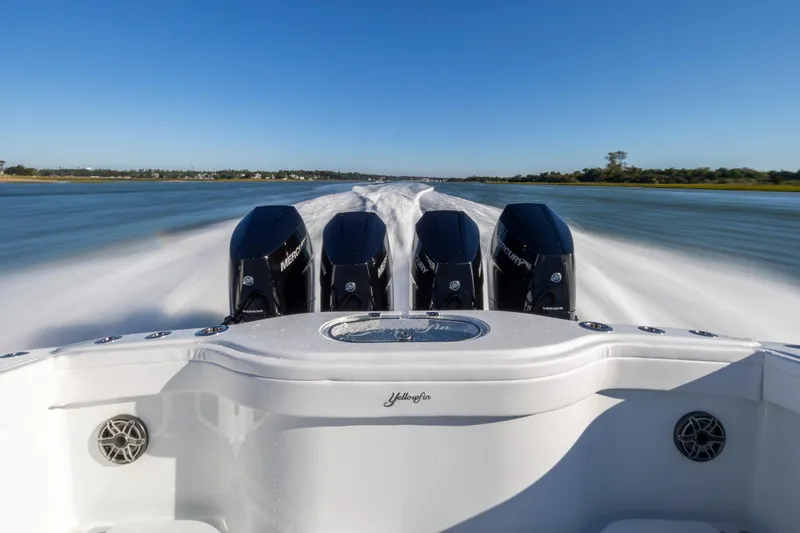  Yacht Photos Pics 2026 Yellowfin 39 Offshore boat speeding on water with four powerful Mercury engines.