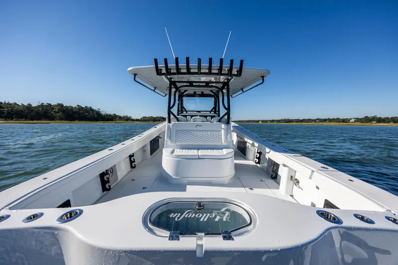  Yacht Photos Pics 2026 Yellowfin 39 Offshore boat on water, clear sky, spacious deck.