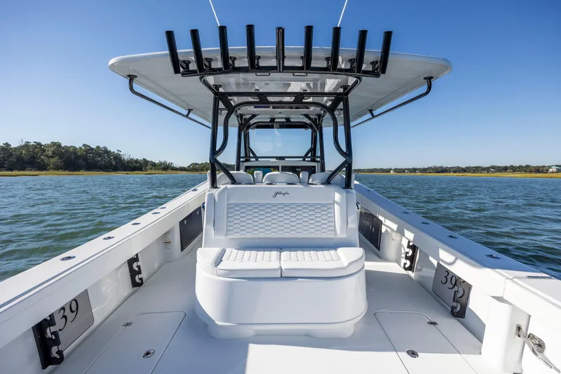  Yacht Photos Pics 2026 Yellowfin 39 Offshore boat on water, featuring spacious deck and seating.