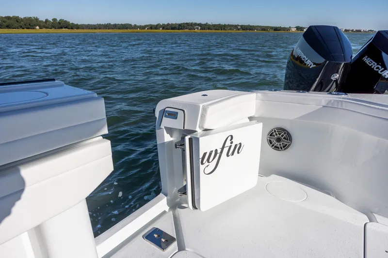  Yacht Photos Pics 2026 Yellowfin 39 Offshore boat with Mercury engines on a calm water backdrop.