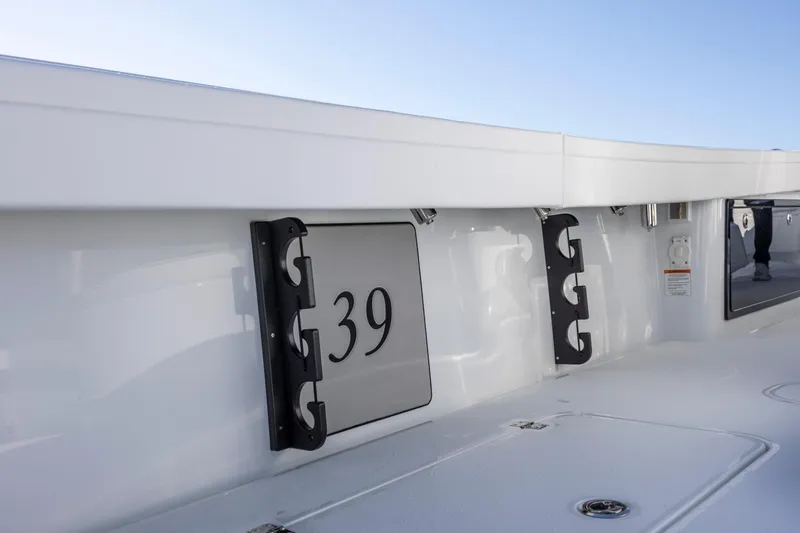  Yacht Photos Pics 2026 Yellowfin 39 Offshore boat interior with rod holders and sleek design.