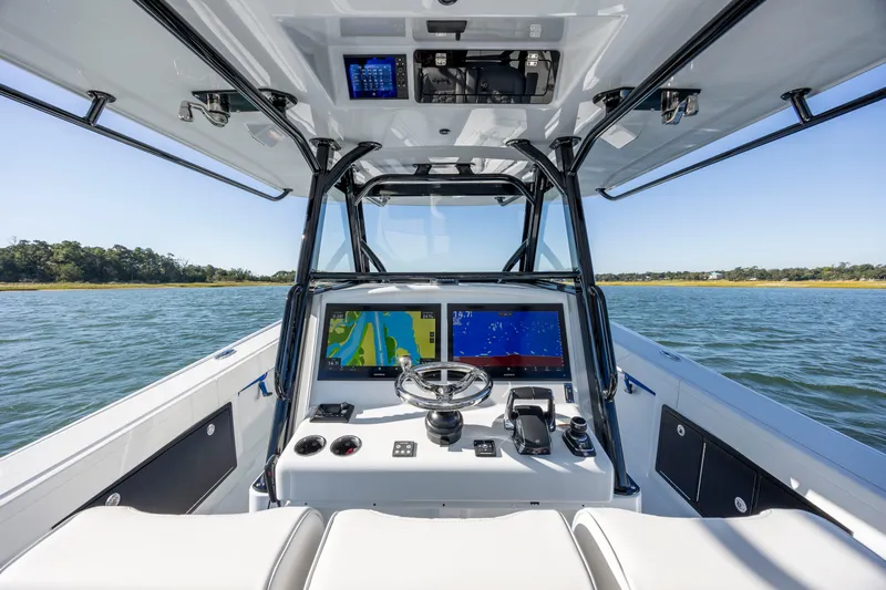  Yacht Photos Pics 2026 Yellowfin 39 Offshore boat cockpit with advanced navigation displays on open water.