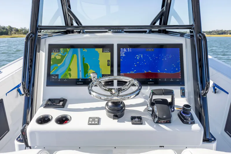  Yacht Photos Pics 2026 Yellowfin 39 Offshore boat dashboard with dual Garmin displays and steering wheel.