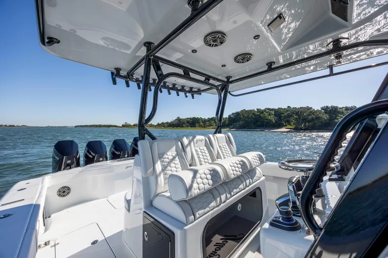  Yacht Photos Pics 2026 Yellowfin 39 Offshore boat interior with luxurious seating and multiple outboard engines.