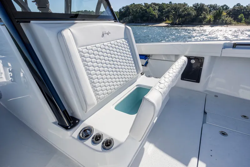  Yacht Photos Pics 2026 Yellowfin 39 Offshore boat interior with white cushioned seating and ocean view.