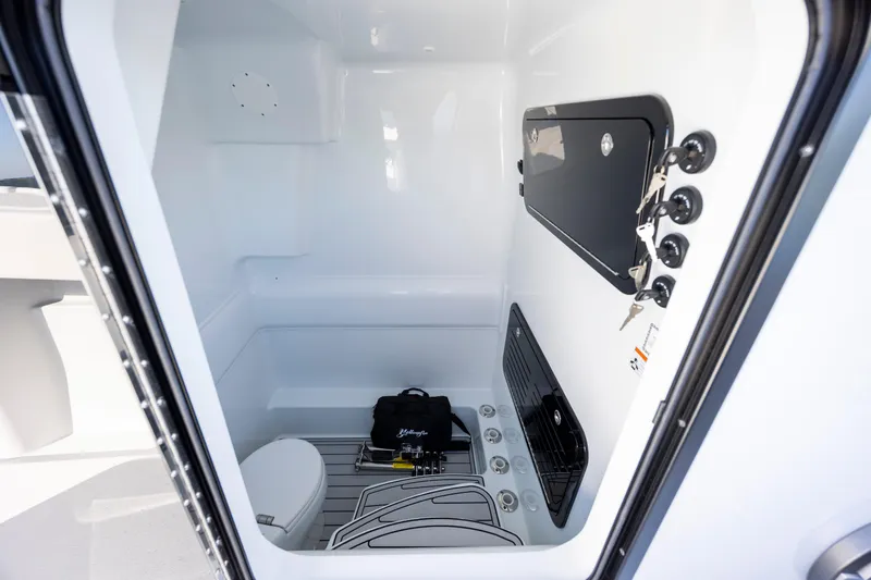  Yacht Photos Pics 2026 Yellowfin 39 Offshore boat interior with storage and seating area.