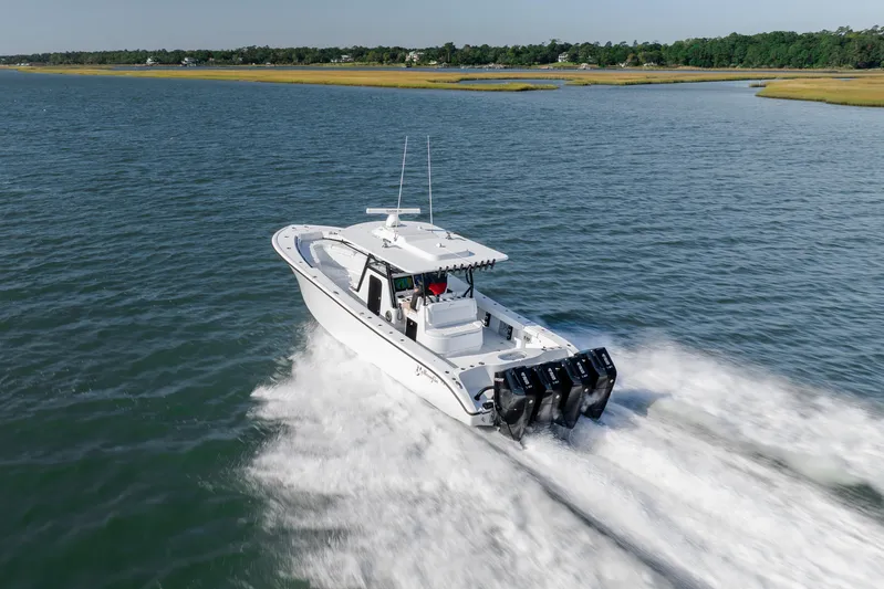  Yacht Photos Pics 2026 Yellowfin 39 Offshore boat cruising on open water, showcasing powerful engines.