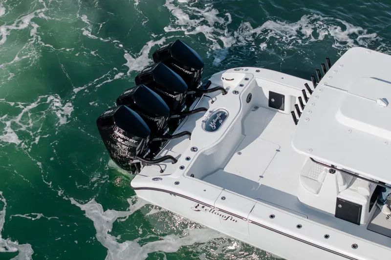  Yacht Photos Pics 2026 Yellowfin 39 Offshore boat with multiple outboard engines on turquoise water.