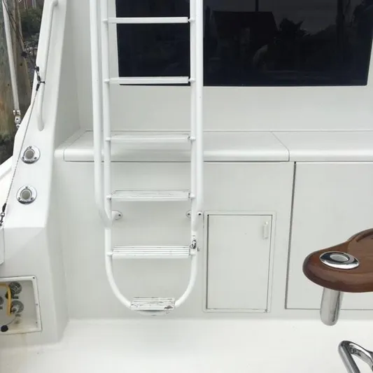 Tiramisu Yacht Photos Pics White ladder and deck area on 1996 Viking 47 Convertible yacht.