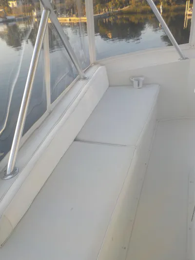 Tiramisu Yacht Photos Pics 1996 Viking 47 Convertible boat interior with white seating and railing.