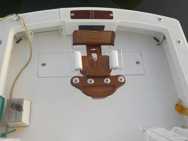 Tiramisu Yacht Photos Pics 1996 Viking 47 Convertible boat deck with wooden fittings and fishing chair.